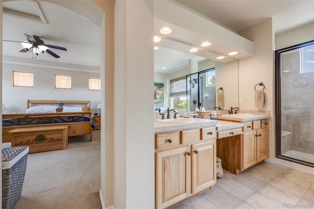 13324 W 86th Dr, Arvada, CO 80005 - full bath featuring ensuite bath, recessed lighting, a stall shower, double vanity, and ceiling fan