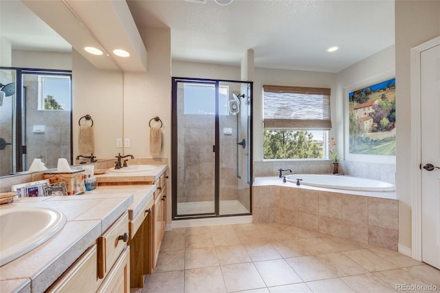 13324 W 86th Dr, Arvada, CO 80005 - full bath with tile patterned floors, a stall shower, a bath, double vanity, and recessed lighting