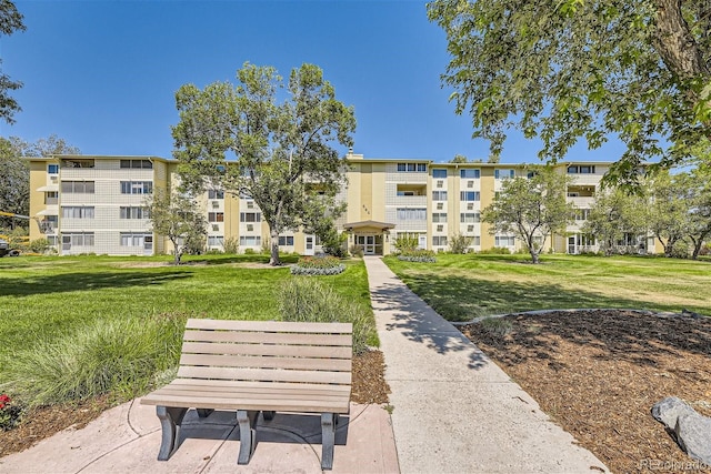 view of community featuring a yard