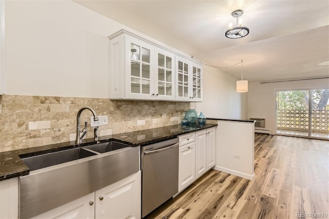 kitchen with pendant lighting, white cabinets, dishwasher, dark stone counters, and backsplash