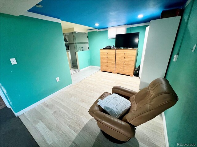 sitting room with light hardwood / wood-style floors