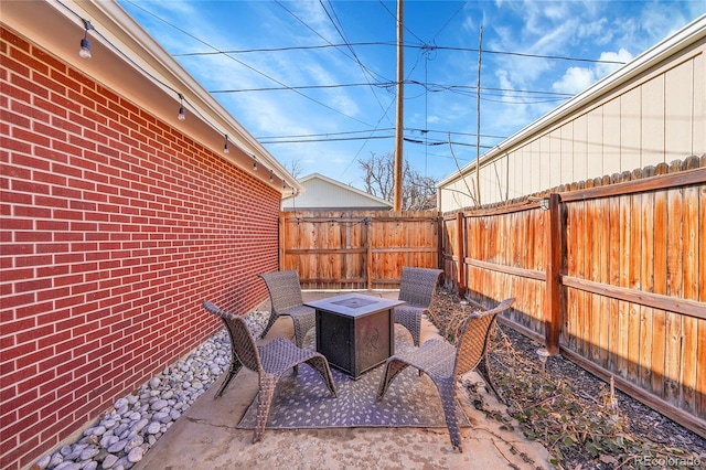 view of patio featuring a fire pit