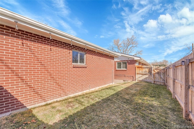 view of side of property featuring a yard