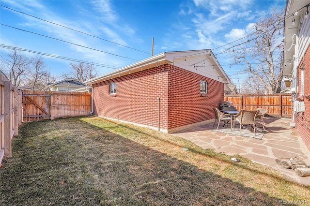 exterior space featuring a yard and a patio area