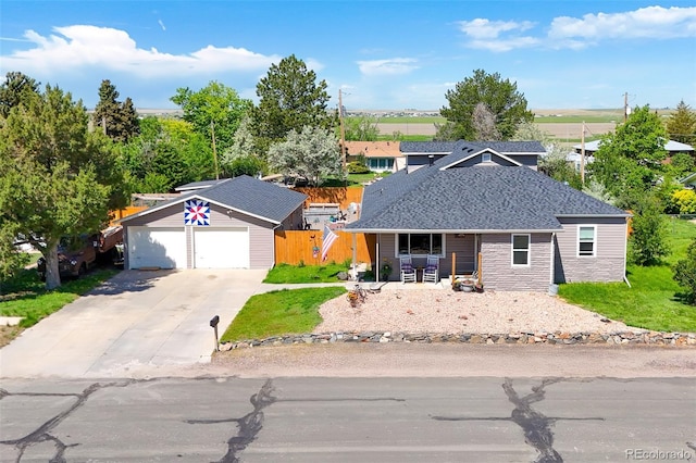 1775 Longbranch St, Strasburg, CO 80136 - ranch-style home featuring a porch, driveway, and roof with shingles