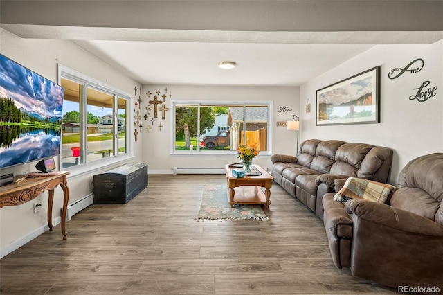 1775 Longbranch St, Strasburg, CO 80136 - living room with wood finished floors and baseboard heating