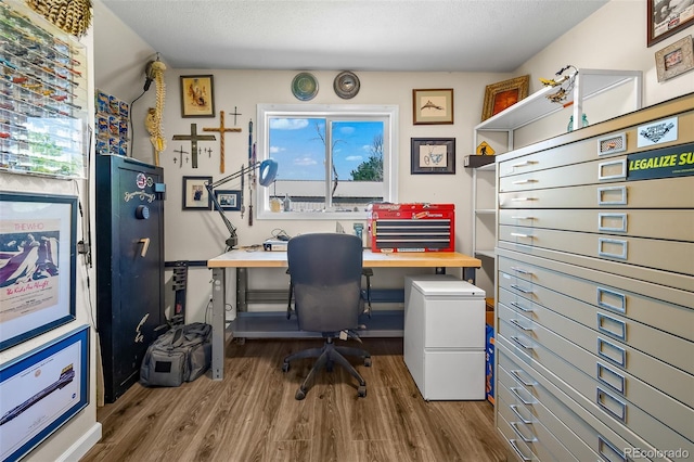 1775 Longbranch St, Strasburg, CO 80136 - home office featuring wood finished floors and a textured ceiling