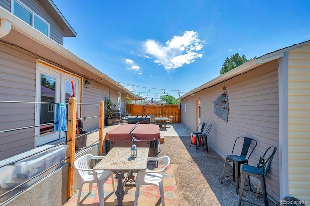 1775 Longbranch St, Strasburg, CO 80136 - view of patio / terrace with a hot tub