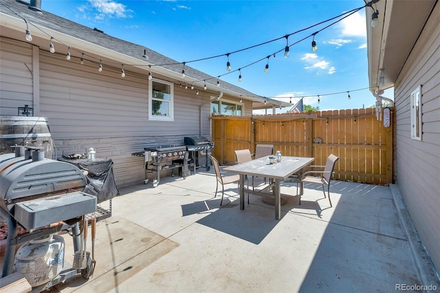 1775 Longbranch St, Strasburg, CO 80136 - view of patio with outdoor dining area and area for grilling