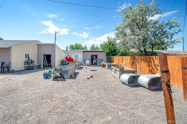 1775 Longbranch St, Strasburg, CO 80136 - back of house with a shed