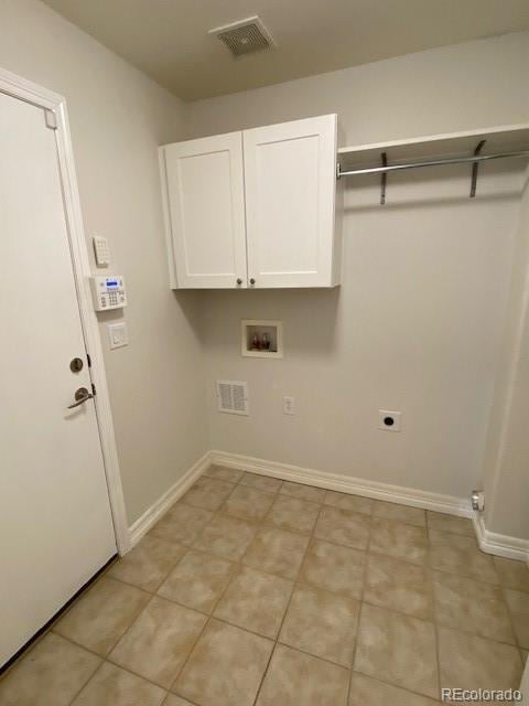 laundry room featuring cabinets, hookup for a washing machine, and electric dryer hookup