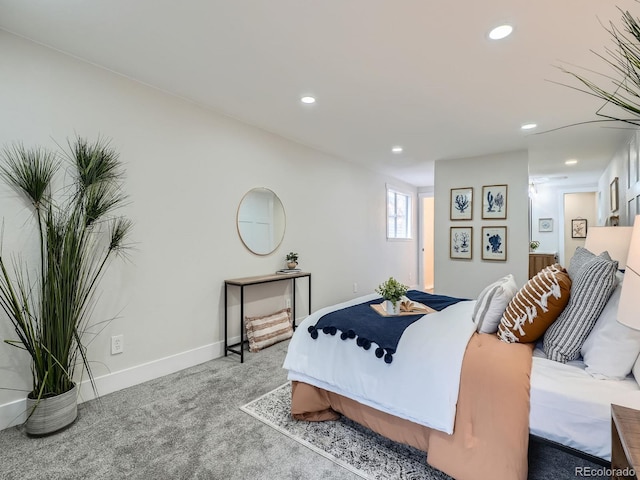 carpeted bedroom featuring recessed lighting and baseboards