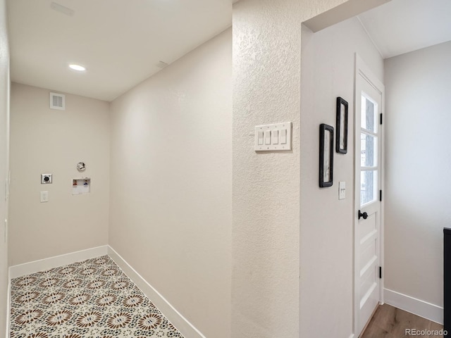 corridor with visible vents and baseboards