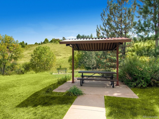 view of home's community with a gazebo, a yard, and a patio area