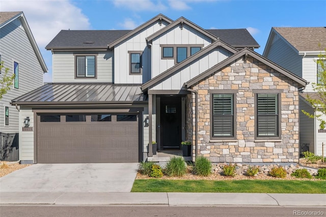 11103 Cloud Shadow St, Littleton, CO 80125 - craftsman-style house with an attached garage, driveway, stone siding, a standing seam roof, and board and batten siding