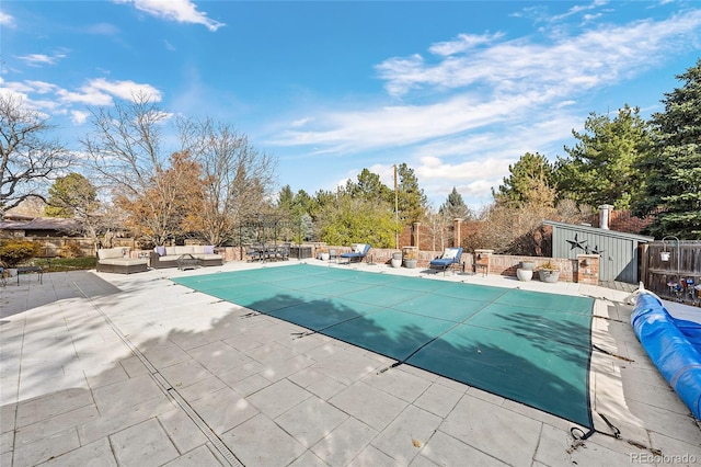 view of pool featuring outdoor lounge area and a patio area