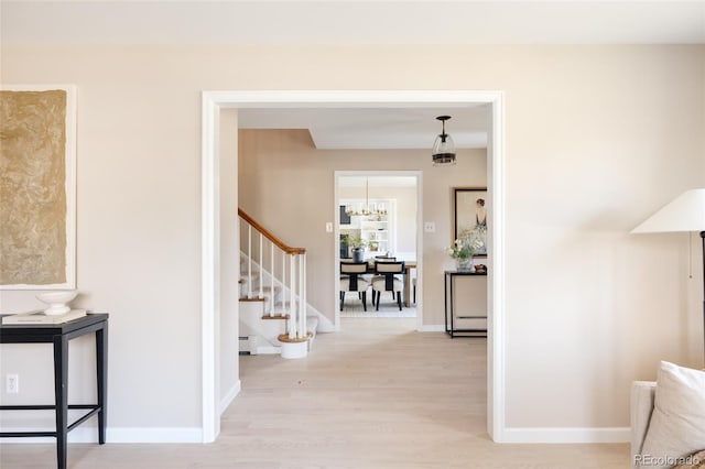 hallway featuring light hardwood / wood-style flooring and a baseboard heating unit