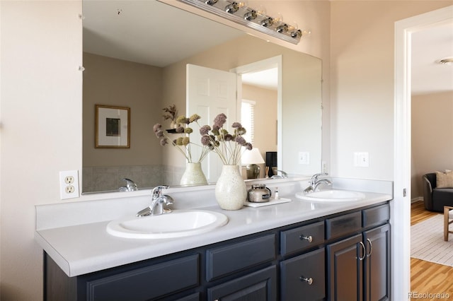 bathroom featuring vanity and wood-type flooring