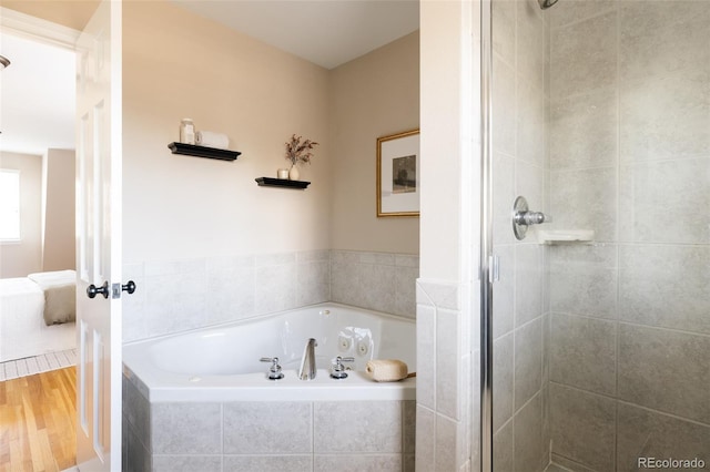 bathroom with wood-type flooring and plus walk in shower