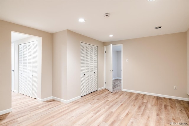 spare room featuring light hardwood / wood-style floors