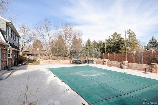 view of swimming pool featuring a patio