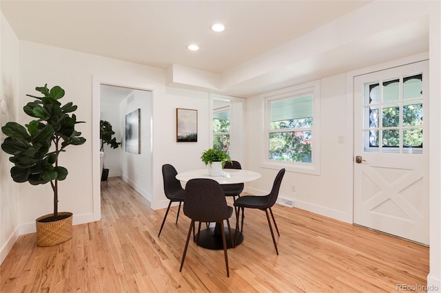 dining space with light hardwood / wood-style flooring