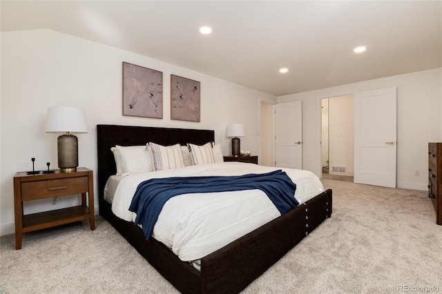 bedroom with light carpet