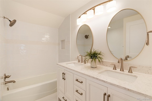 bathroom with vanity and tiled shower / bath