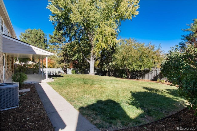 view of yard featuring a patio and central air condition unit