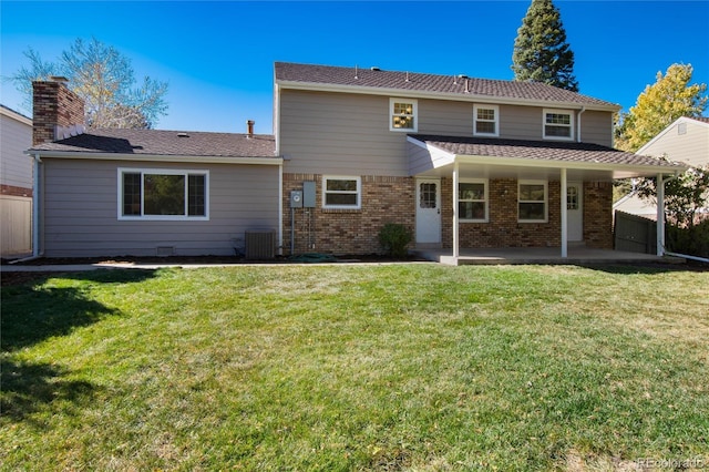 back of house featuring a patio, central AC, and a lawn