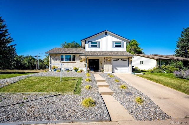 view of front of house with a front yard and a garage