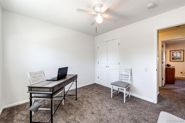 office area with ceiling fan and dark carpet