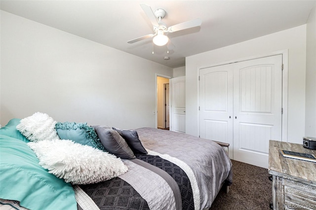 carpeted bedroom with ceiling fan and a closet