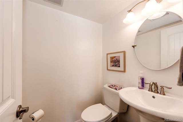 bathroom with sink and toilet