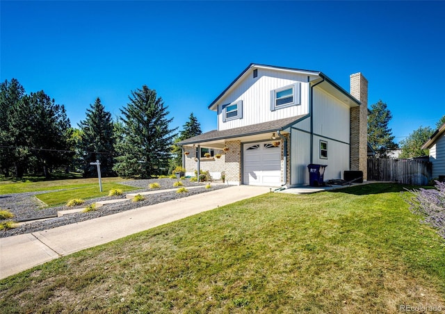 view of front of home with a garage and a front lawn