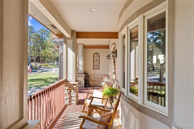 balcony with covered porch and visible vents