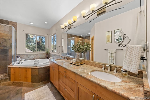 full bathroom with a garden tub, double vanity, a sink, and a shower stall