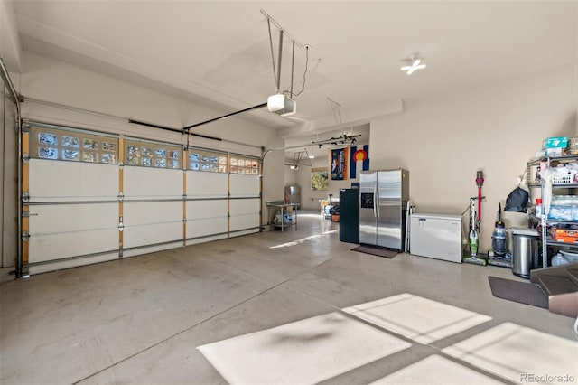 garage featuring a garage door opener, fridge, and stainless steel fridge with ice dispenser