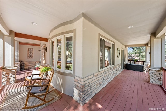 wooden deck featuring covered porch