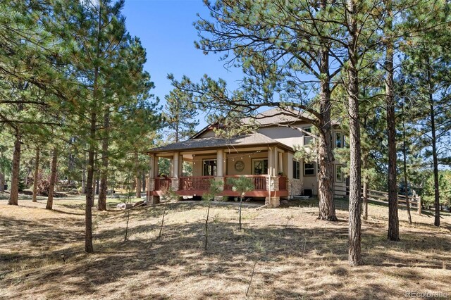 view of front of home with a porch and stucco siding