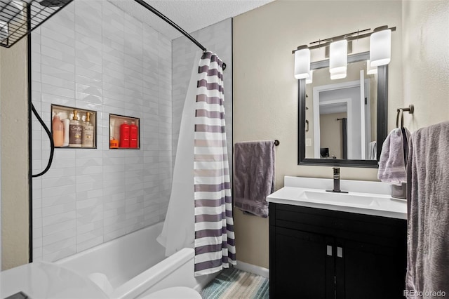 bathroom with a textured ceiling, vanity, and shower / bathtub combination with curtain