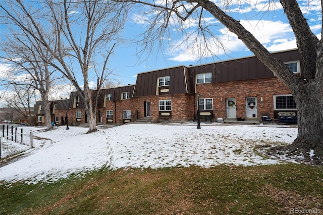 view of snow covered property