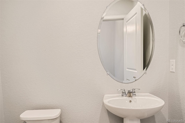 bathroom with sink and toilet