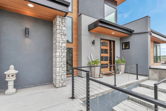 202 October Pl, Castle Rock, CO 80104 - property entrance with stucco siding and a patio area