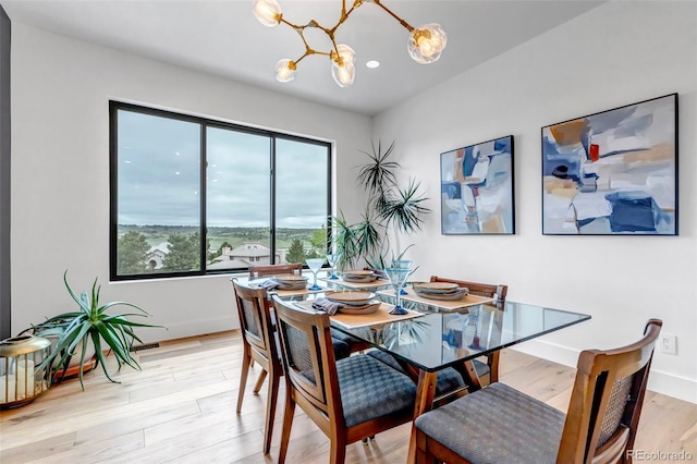 202 October Pl, Castle Rock, CO 80104 - dining room with a chandelier, light wood-style floors, baseboards, and recessed lighting