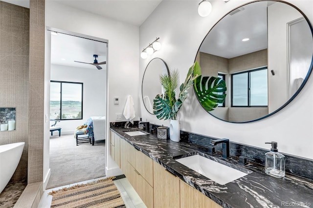 202 October Pl, Castle Rock, CO 80104 - full bathroom featuring a freestanding tub and double vanity