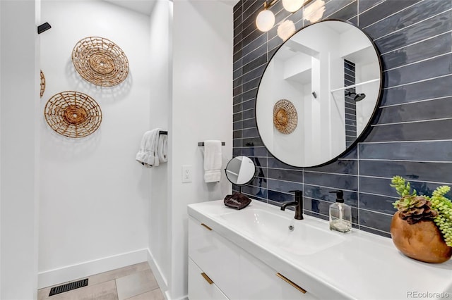 202 October Pl, Castle Rock, CO 80104 - bathroom featuring vanity, baseboards, and tile patterned flooring