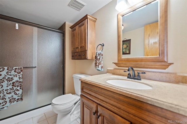 bathroom with walk in shower, vanity, toilet, and tile patterned flooring