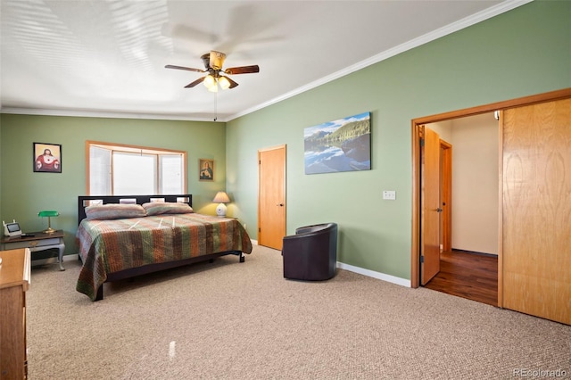 bedroom with ornamental molding, carpet flooring, and ceiling fan