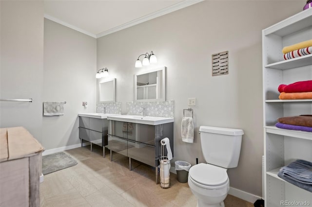 bathroom featuring ornamental molding, toilet, and vanity